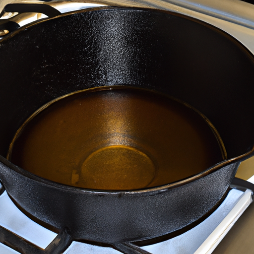 A Dutch oven being seasoned with vegetable oil to maintain its non-stick surface.